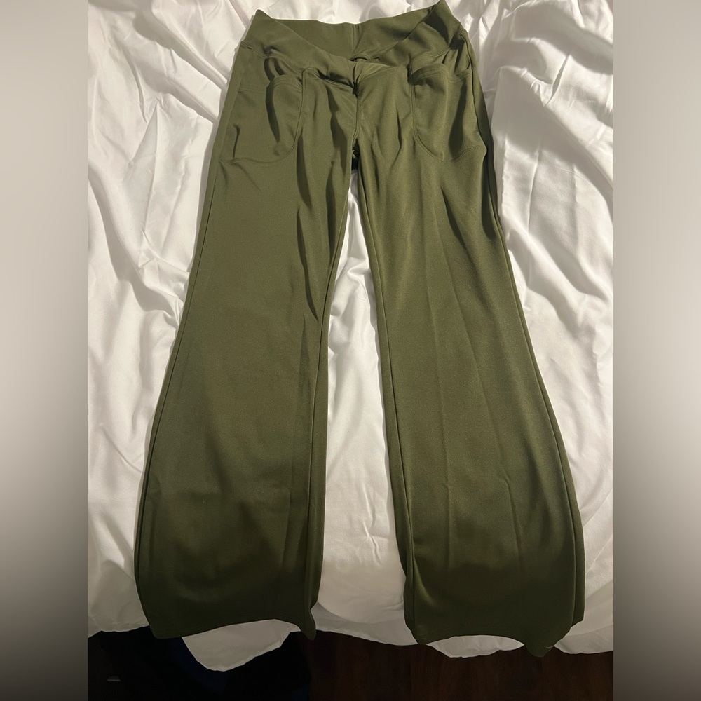 Pair of green flare leggings size medium
